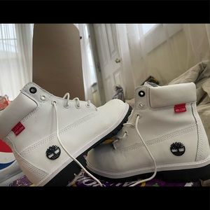 white timbs slightly used. size 5 big kids and 7 womens.